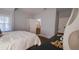Cozy bedroom with wood flooring, and access to bathroom at 922 E Ida St, Tampa, FL 33603