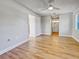 Spacious bedroom with ceiling fan, wood-look floors, and access to bath at 865 Everest Rd, Venice, FL 34293