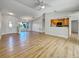 Open living room with kitchen view and wood-look floors at 865 Everest Rd, Venice, FL 34293