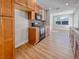 Kitchen with wood cabinets, granite counters, and modern appliances at 865 Everest Rd, Venice, FL 34293