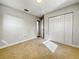 Bright bedroom with neutral walls, carpet, and spacious closet at 865 Everest Rd, Venice, FL 34293