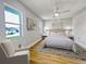 Bedroom with a bed, nightstands and an armchair at 865 Everest Rd, Venice, FL 34293