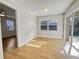 Sunroom with wood-look floors and access to the backyard at 865 Everest Rd, Venice, FL 34293