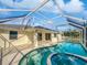 Inviting pool and spa with screened enclosure at 865 Everest Rd, Venice, FL 34293