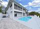 Backyard with pool and patio area, ideal for outdoor activities and relaxation in a private setting at 7438 Gulf Way, Hudson, FL 34667