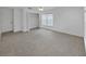 Spacious bedroom with a walk-in closet, tile flooring, and a ceiling fan at 7438 Gulf Way, Hudson, FL 34667