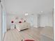 Spacious bedroom with ceiling fan, wood-look floors, and neutral decor at 7438 Gulf Way, Hudson, FL 34667