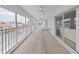 Enclosed Lanai with ceiling fans and views of the canal at 7438 Gulf Way, Hudson, FL 34667