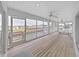 Enclosed Lanai with ceiling fans and views of the canal at 7438 Gulf Way, Hudson, FL 34667