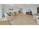 Open living room with ceiling fans, recessed lights and wood-look flooring at 7438 Gulf Way, Hudson, FL 34667