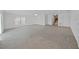 Bright living room with tile floors, ceiling fan and large windows that provide ample natural light at 7438 Gulf Way, Hudson, FL 34667