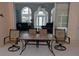 Outdoor patio with table and chairs, offering views of the living room at 1 Long Meadow Ln, Rotonda West, FL 33947
