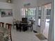 Casual dining area with access to the pool and patio at 1 Long Meadow Ln, Rotonda West, FL 33947