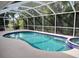 Relaxing screened pool and spa with ample deck space at 1 Long Meadow Ln, Rotonda West, FL 33947