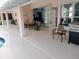 Spacious pool patio with seating area, grill, and access to the pool at 1 Long Meadow Ln, Rotonda West, FL 33947