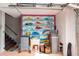 Garage with unique fish mural, utility sink, and water softener at 12550 Capri N Cir, Treasure Island, FL 33706