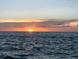 Stunning ocean sunset with vibrant colors in the sky at 12550 Capri N Cir, Treasure Island, FL 33706