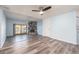 Open living area with hardwood floors and a stone fireplace at 12550 Capri N Cir, Treasure Island, FL 33706