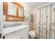 Bathroom with tub shower, and seashell decor at 12550 Capri N Cir, Treasure Island, FL 33706