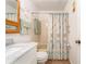 Bathroom with tub shower, and seashell decor at 12550 Capri N Cir, Treasure Island, FL 33706