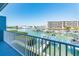 Balcony overlooking a marina with boats and waterfront views at 12550 Capri N Cir, Treasure Island, FL 33706