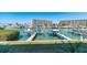 Stunning waterfront view with boats and lush landscaping at 12550 Capri N Cir, Treasure Island, FL 33706
