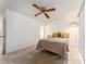 Bright bedroom with a double bed and ceiling fan at 12550 Capri N Cir, Treasure Island, FL 33706