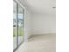 Bright living room with sliding glass doors leading to a patio and backyard at 14074 Ginnie Springs Way, Parrish, FL 34219