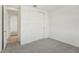 Simple bedroom with grey carpet and double door closet at 14074 Ginnie Springs Way, Parrish, FL 34219