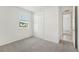 Simple bedroom with window, closet, and grey carpet at 14074 Ginnie Springs Way, Parrish, FL 34219