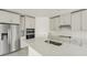 Stainless steel appliances and white quartz countertops at 14074 Ginnie Springs Way, Parrish, FL 34219