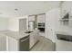 Kitchen island with sink, dishwasher, and quartz countertop at 14074 Ginnie Springs Way, Parrish, FL 34219