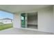 Covered patio with sliding glass doors leading to interior at 14074 Ginnie Springs Way, Parrish, FL 34219
