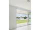 Living area featuring sliding glass doors and view of backyard at 14074 Ginnie Springs Way, Parrish, FL 34219