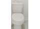 A clean bathroom with toilet and tiled floor at 14074 Ginnie Springs Way, Parrish, FL 34219