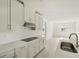 Gas cooktop, stainless steel appliances, and white cabinets at 14074 Ginnie Springs Way, Parrish, FL 34219