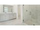 Bright bathroom with double vanity and walk in shower at 14074 Ginnie Springs Way, Parrish, FL 34219