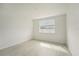 Bright bedroom featuring wood-look tile flooring and a window at 14074 Ginnie Springs Way, Parrish, FL 34219