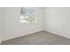 Bright bedroom with carpet flooring and a window offering natural light at 14074 Ginnie Springs Way, Parrish, FL 34219