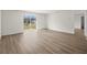 Large bedroom featuring wood-look flooring and sliding glass doors at 5255 Farmington Ave, North Port, FL 34288