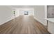 Spacious living area with wood-look flooring and backyard access at 5255 Farmington Ave, North Port, FL 34288