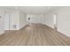 Spacious living room with light wood flooring and an open floor plan at 5255 Farmington Ave, North Port, FL 34288