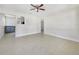 Open living area with tile floors and kitchen view at 313 E Hydrangia St, Tampa, FL 33612