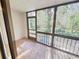 Bright sunroom with tiled floor and access to the outdoors at 1200 Tarpon Woods Blvd # S2, Palm Harbor, FL 34685