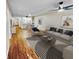 Open living room with hardwood floors and kitchen views at 1200 Tarpon Woods Blvd # S2, Palm Harbor, FL 34685
