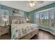 Serene bedroom with a king-size bed, plantation shutters, and beach-themed decor at 7442 Palm Island Dr # 3624, Placida, FL 33946
