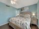 Relaxing bedroom features a queen bed, ceiling fan and wooden nightstand, creating a serene retreat at 7442 Palm Island Dr # 3624, Placida, FL 33946