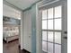 View into the bedroom showing a comfortable king bed with beach-themed decor at 7442 Palm Island Dr # 3624, Placida, FL 33946