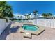 Community pool and hot tub surrounded by lush landscaping and comfortable lounge chairs, resort-style living at 7442 Palm Island Dr # 3624, Placida, FL 33946