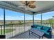 Enjoy the ocean view from this screened porch with a ceiling fan and comfortable seating at 7442 Palm Island Dr # 3624, Placida, FL 33946